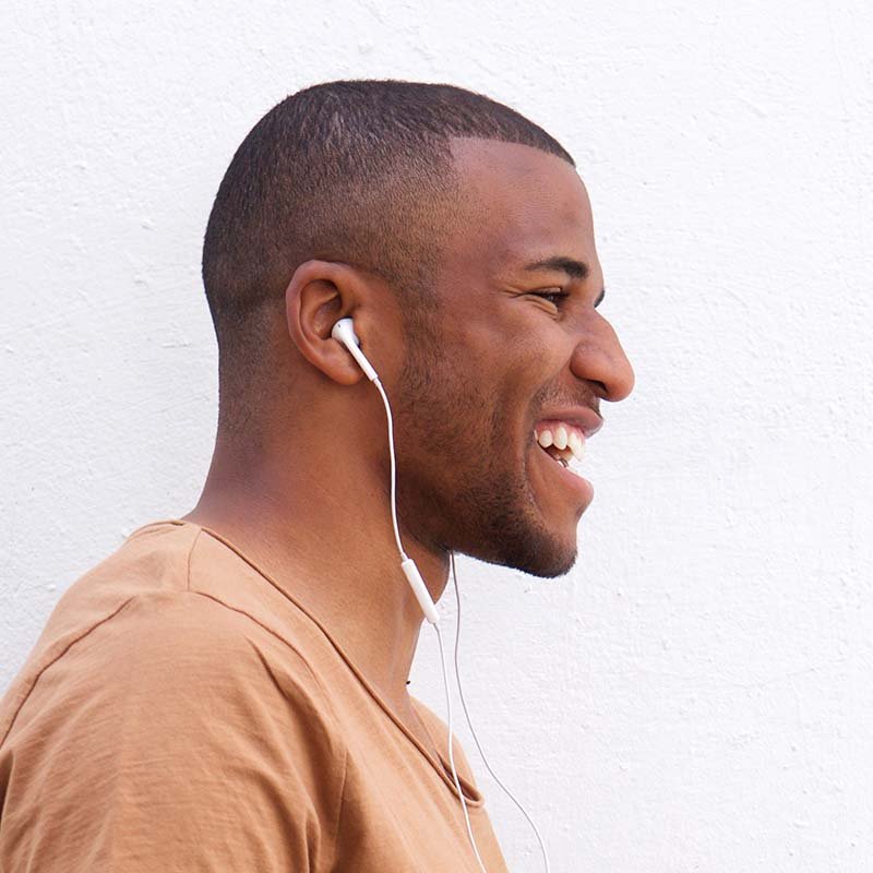 Portrait of afro american man listening music agai CAJQK28.jpg