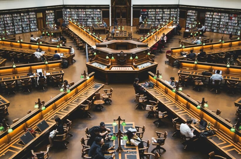 People studying inside a library setting